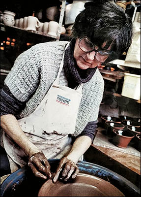 Portrait of potter Molly Curley at work