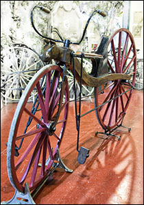 Photo of early wooden bicycle at National Cycle Museum