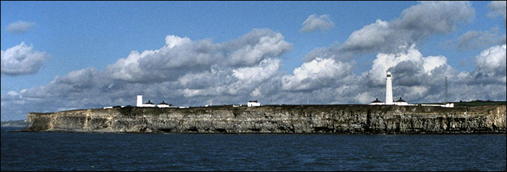 Nash Point lighthouse towers viewed from the sea
