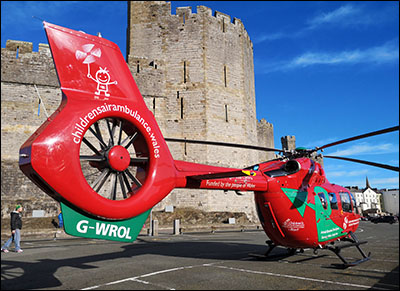 Photo of air ambulance beside Caernarfon Castle