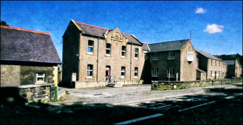 Photo of handaxes found at Coygan Cave Photo of Conwy hospital before demolition