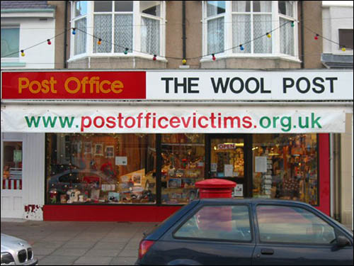 Photo of the Wool Post with Post Office Victims banner