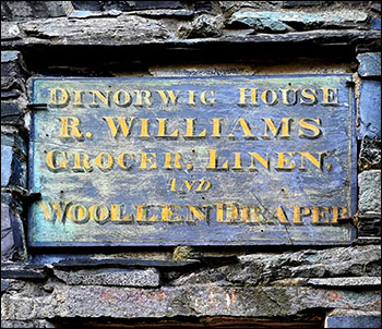 Photo of old draper's shop sign at Dinorwig House