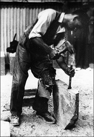 Old photo of Dinorwig quarryman at work Old photo of Dinorwig quarryman at work