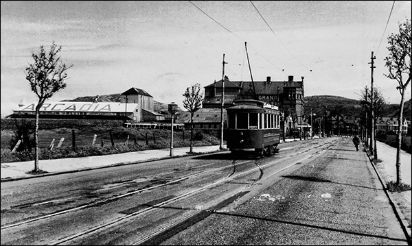Old photo of tramway in Mostyn Broadway