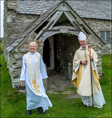 Photo of newly ordained Eryl Parry with bishop at Llangelynnin church