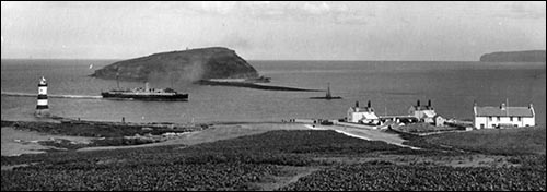 Old photo of Trywn Du lighthouse and pilots' cottages
