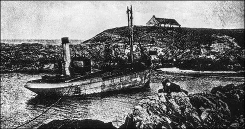 Old photo of steamer and cottage at Porth Ysgaden
