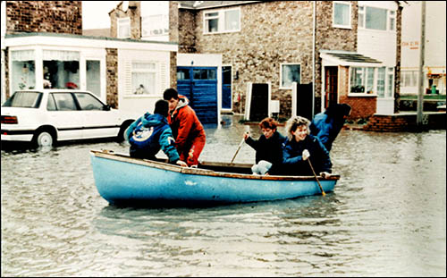 Photo of residents in a boat during 1990 Towyn floods