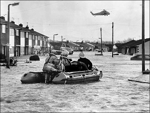 Photo of rescue helicopter and boat during Towyn floods in 1990