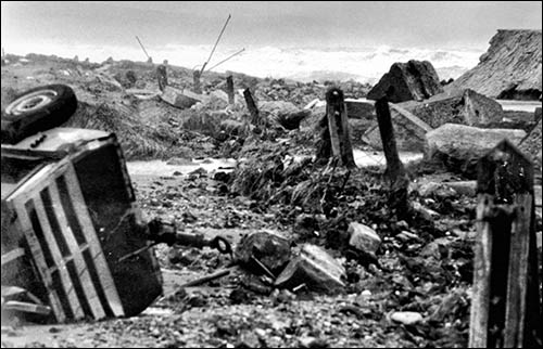 Photo of damaged sea defences at Towyn in 1990