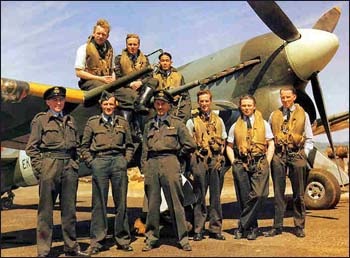 group photo by plane including Gerald Jones